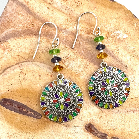 Silver Earrings adorned with crystals and multi colored charms. 2.5”