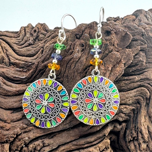 Silver Earrings adorned with crystals and multi colored charms. 2.5”