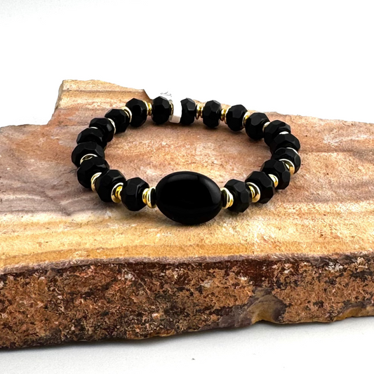 Bracelet | Onyx Faceted Rondells | 18K Gold-plated Saucer Beads | Oval Onyx Focal Bead