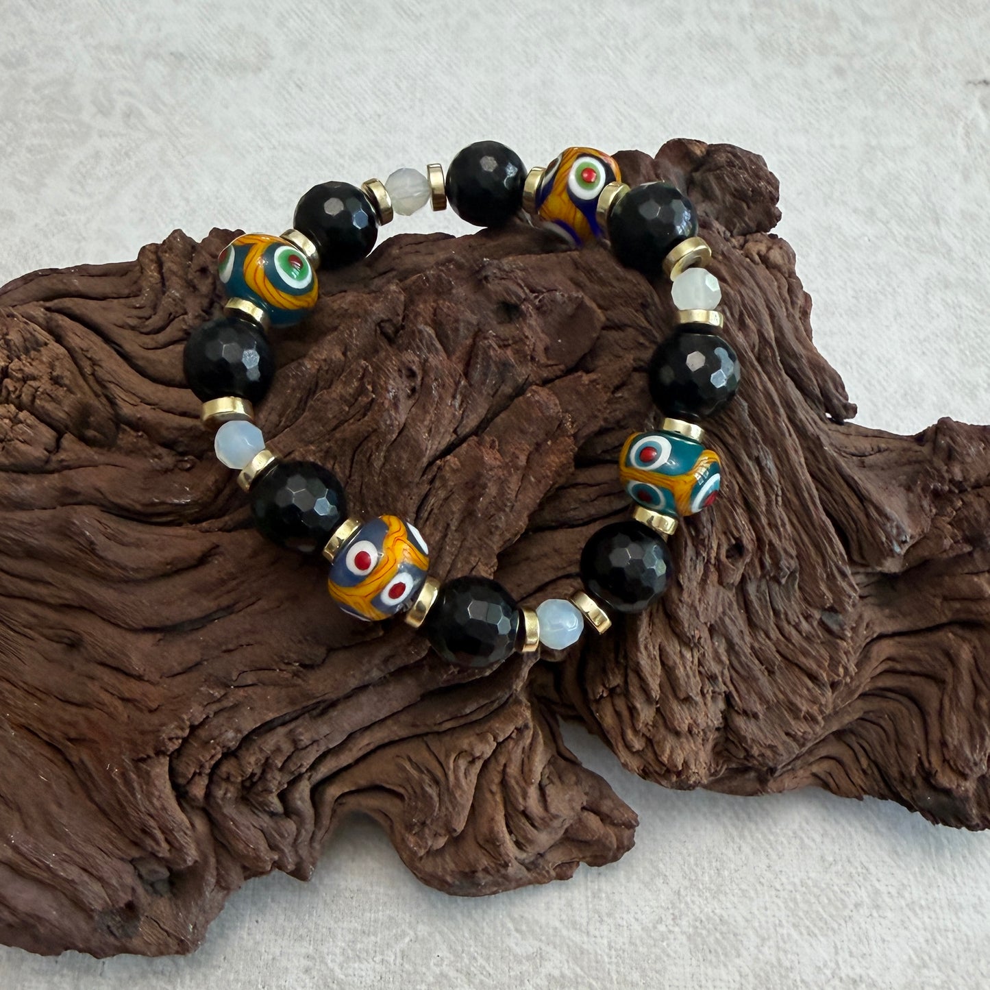 Bracelet | Onyx | Handmade Glass Beads | Faceted Onyx | Moonstone | 18K Gold-plated discs | Stretch